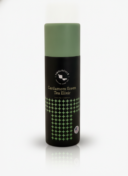 Cardamom & Green Tea Elixir by TMolecule — matte black bottle with a sage-green cap, on a white background